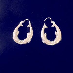 14K white gold kissing dolphin earrings. Textured and high polished.